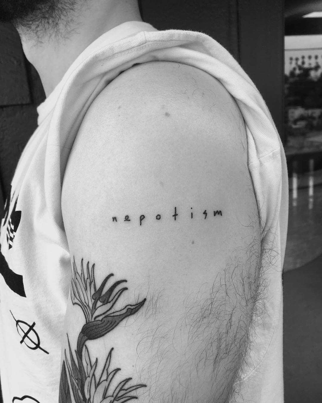 Nepotism tattoo by Robbie Ra Moore