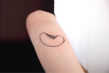 Peach slice tattoo by Ann Gilberg