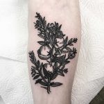 Pomegranate branch tattoo by Deborah Pow
