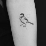 Small tit tattoo by Jakub Nowicz
