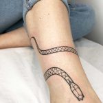 Snake on an ankle by Loz Thomas