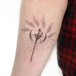 Sword and moon tattoo by Gianina Caputo