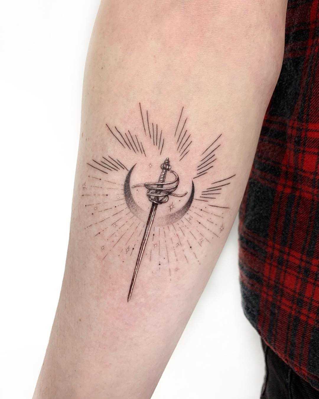Sword and moon tattoo by Gianina Caputo