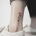 Tiny ankle flower by anton1otattoo