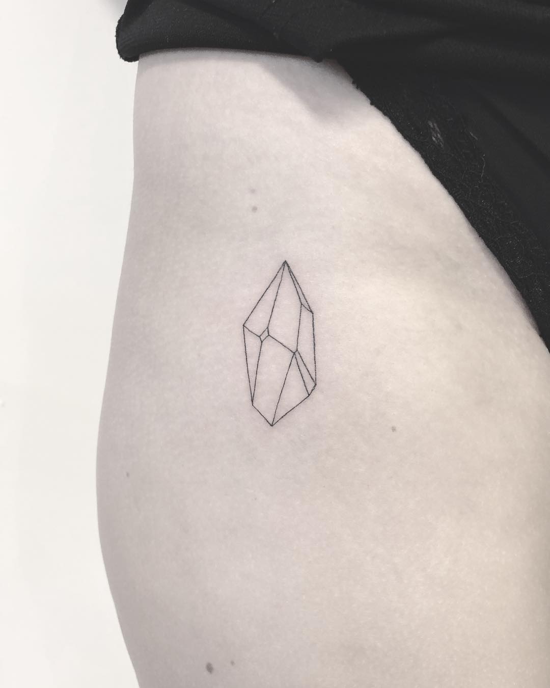 Tiny crystal tattoo by Annelie Fransson 