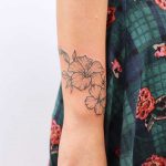 Wrapping hibiscus tattoo by Zaya Hastra