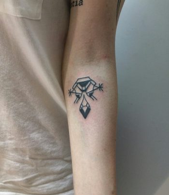 A blackwork symbol by tattooist Meritattoon
