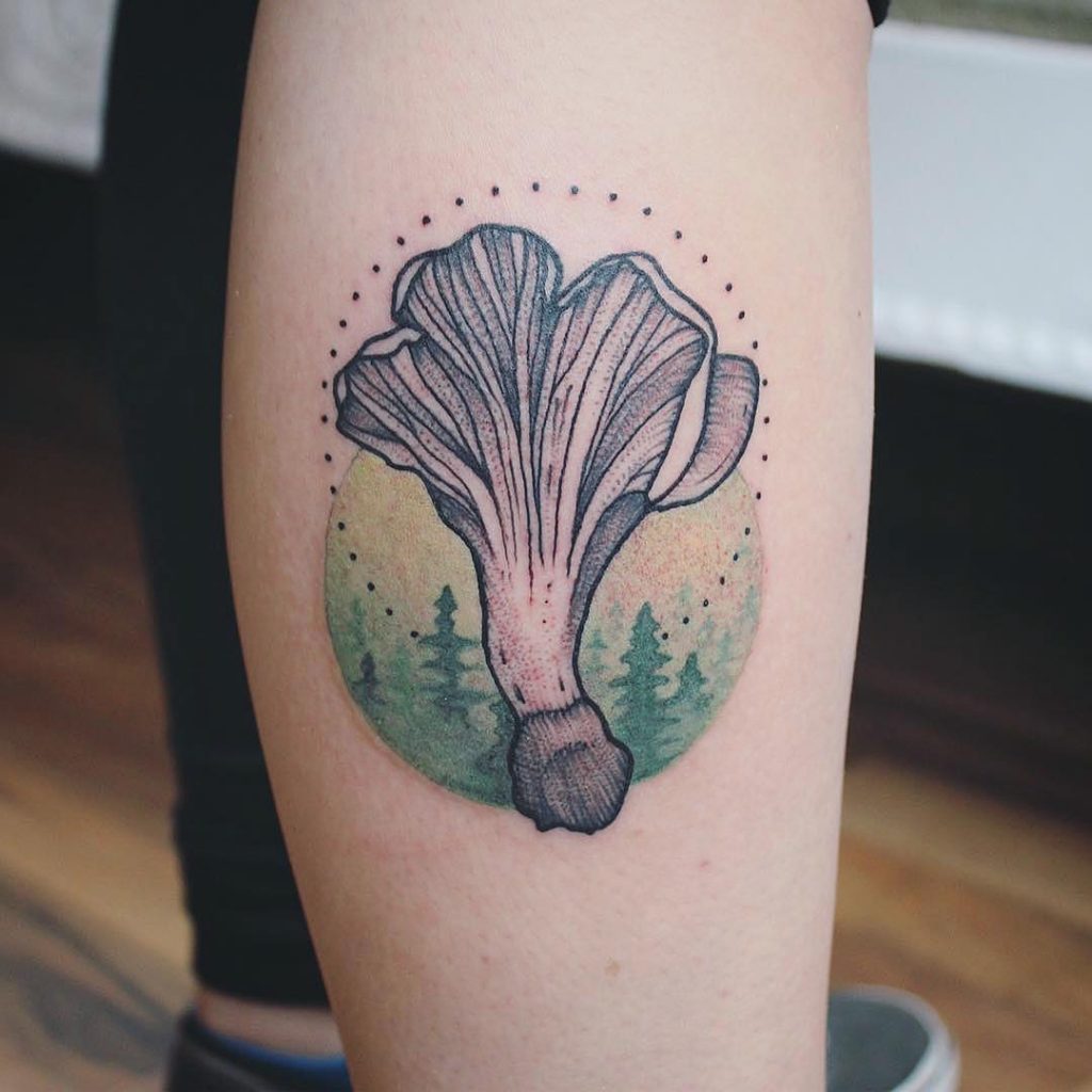 Black tree tattoos on calves
