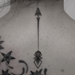 Arrow on the back by tattoo Oliver Whiting