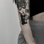 Blackwork doberman tattoo by Krzysztof Szeszko