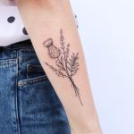 Bouquet of thistle, lavender, and gypsophilia tattoo by Zaya Hastra