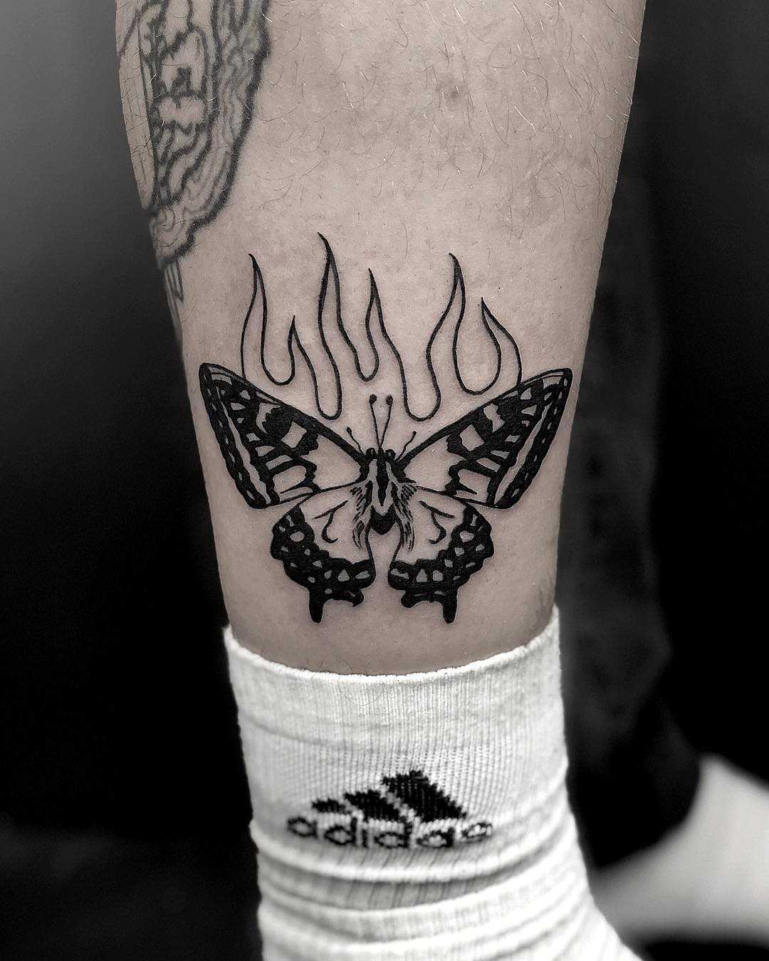 Burning butterfly tattoo by Loz McLean