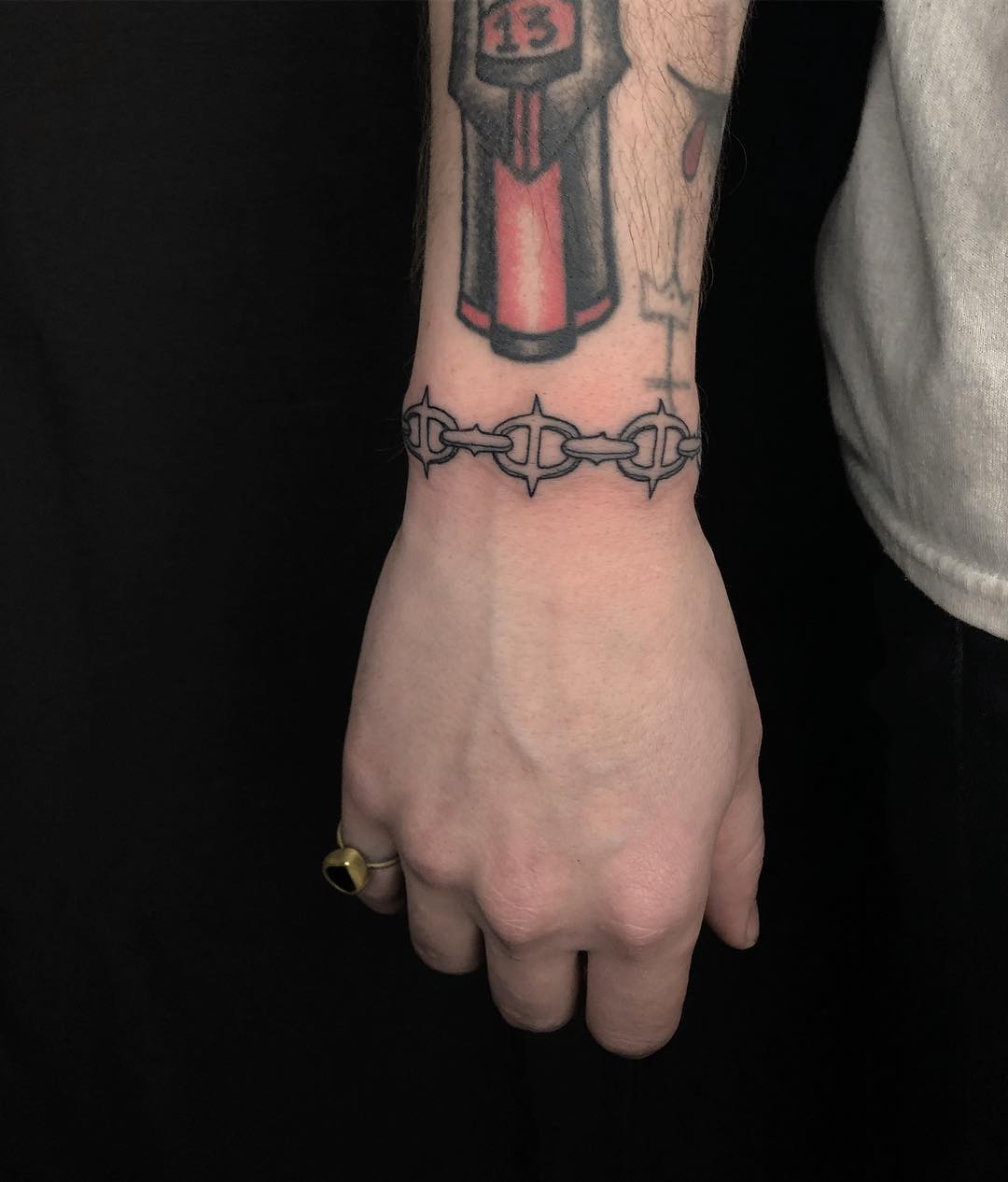 Chainlink bracelet tattoo by Tine DeFiore