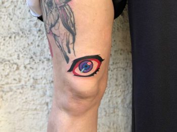 Colorful eye tattoo byEugene Dusty Past