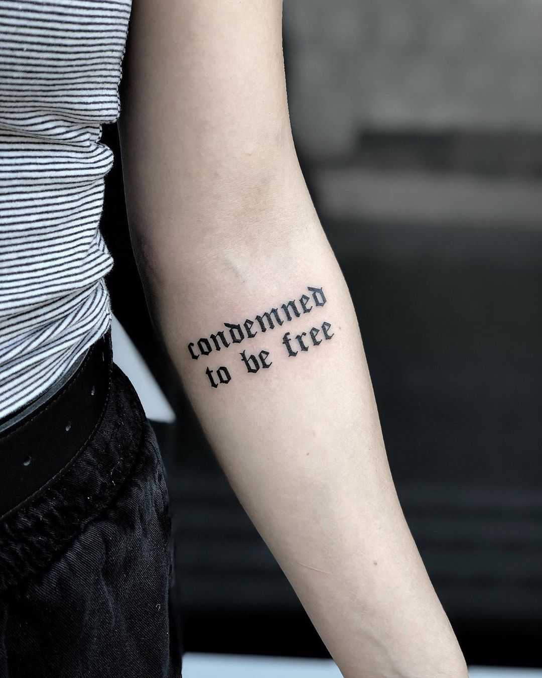 Condemned to be free tattoo by Loz McLean