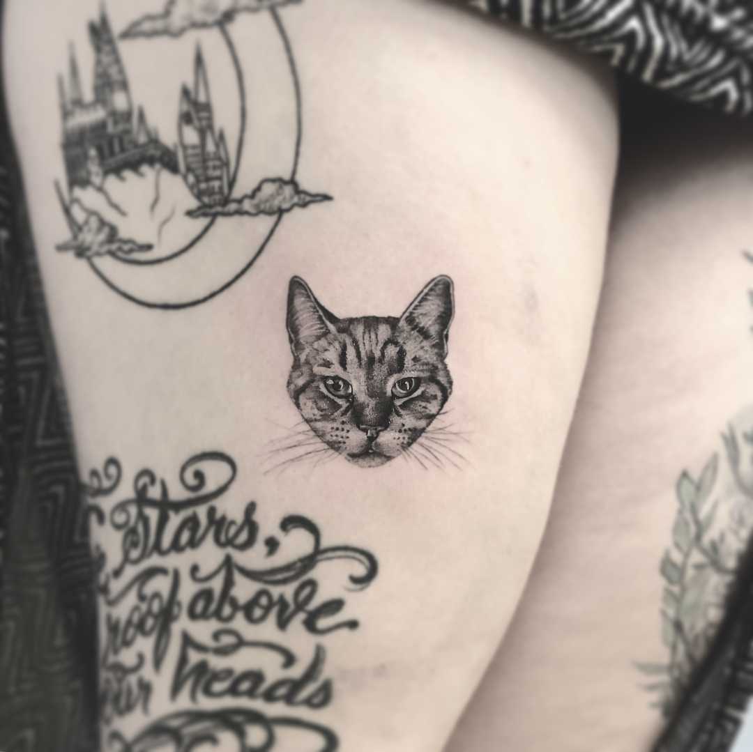 Cute cat portrait tattoo by Annelie Fransson