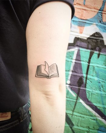 Cute little notebook tattoo by Kirk Budden