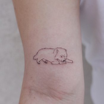 Cute lying dog tattoo by tattooist Nemo