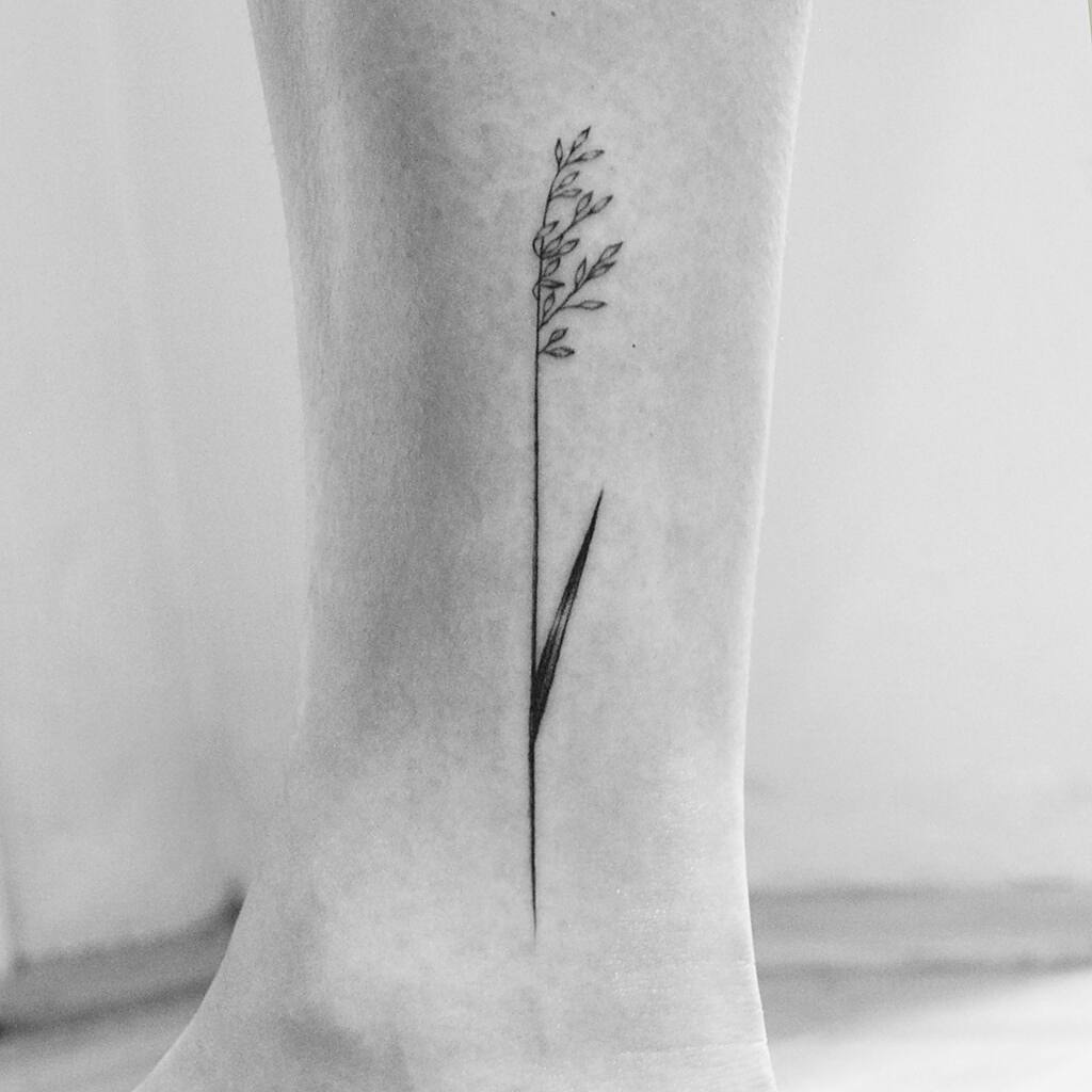 Delicate wildflower tattoo by Amanda Piejak
