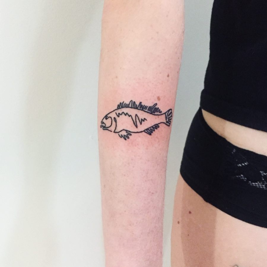 Fish tattoo by Suki Lune