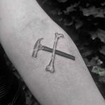 Hammer and bone tattoo by Oliver Whiting
