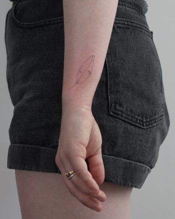Hand-poked tiny leaf by Lara Maju