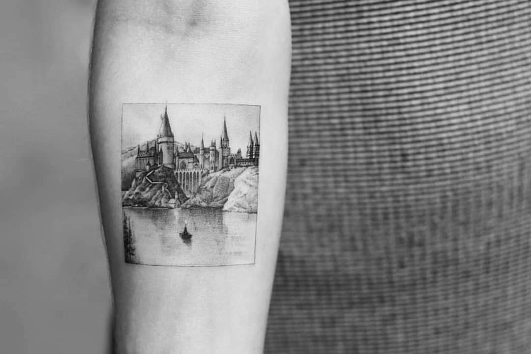 Hogwarts school tattoo by Dragon Ink