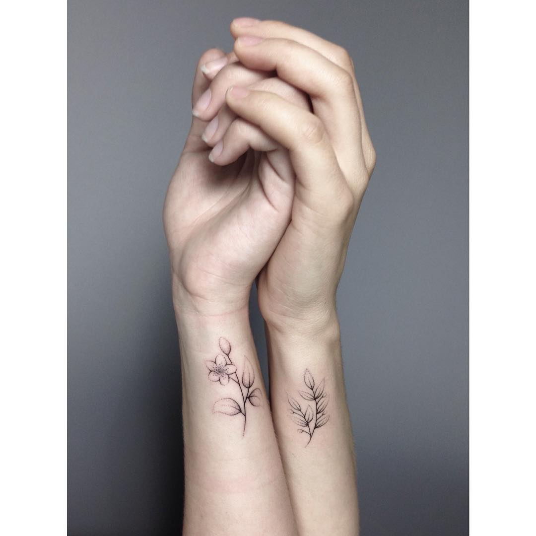 Matching Jasmine tattoos for sisters by Lara Maju