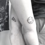 Matching rocket and moon tattoos by Loughie Alston