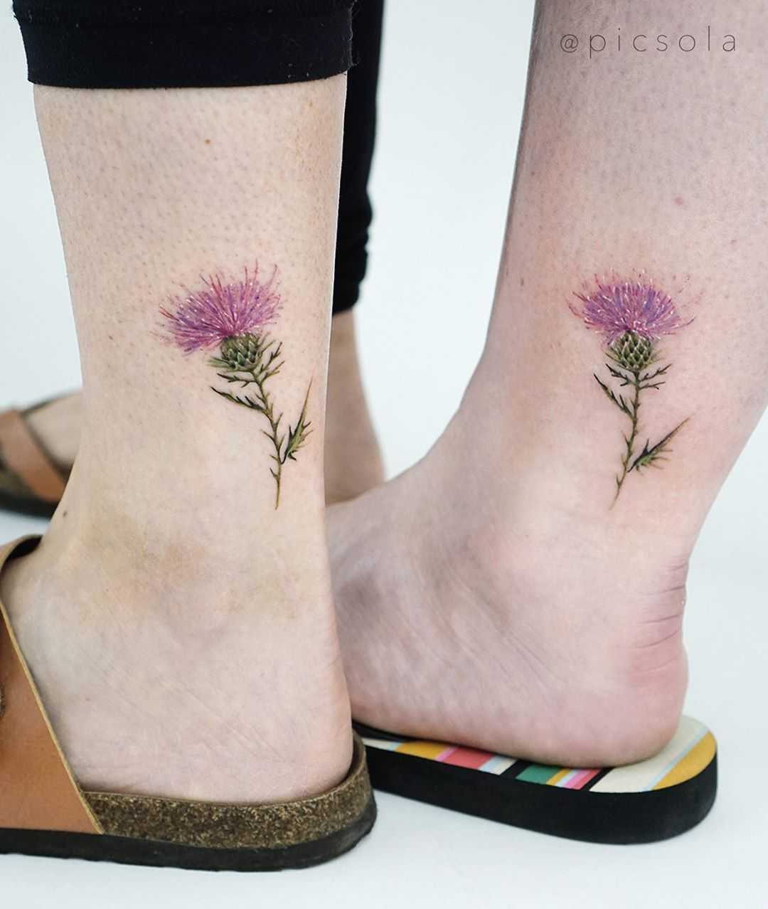 Matching thistle tattoos by tattooist picsola