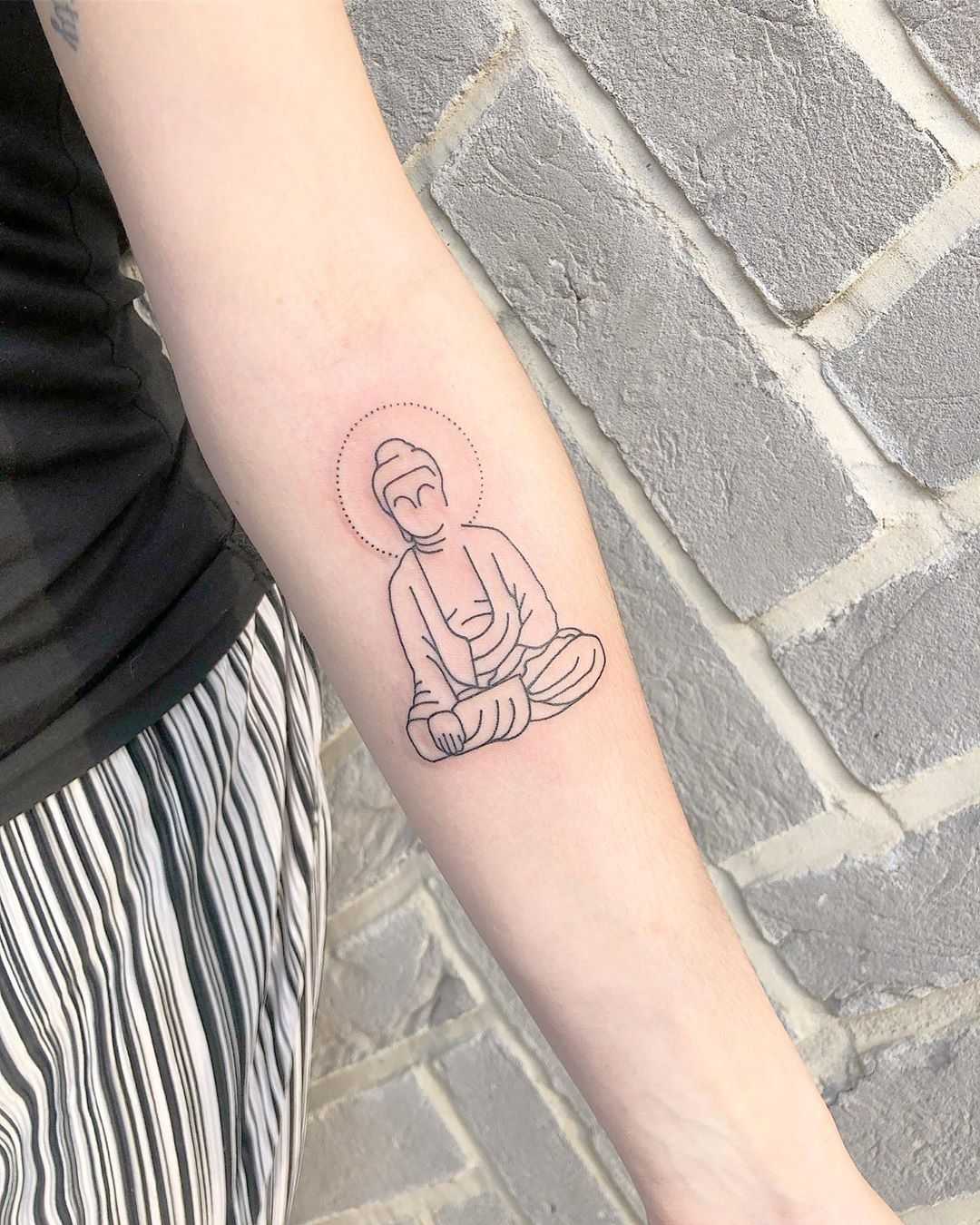 Minimalist Buddha tattoo by Loz Thomas 