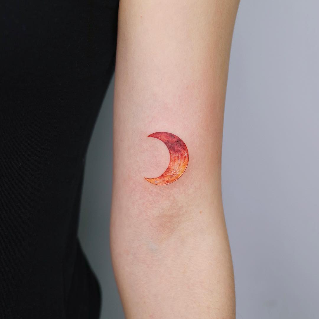 Orange moon tattoo by tattooist Nemo