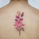 Orchids, Lotus, and Burmese Rosewood flower tattoo by tattooist picsola