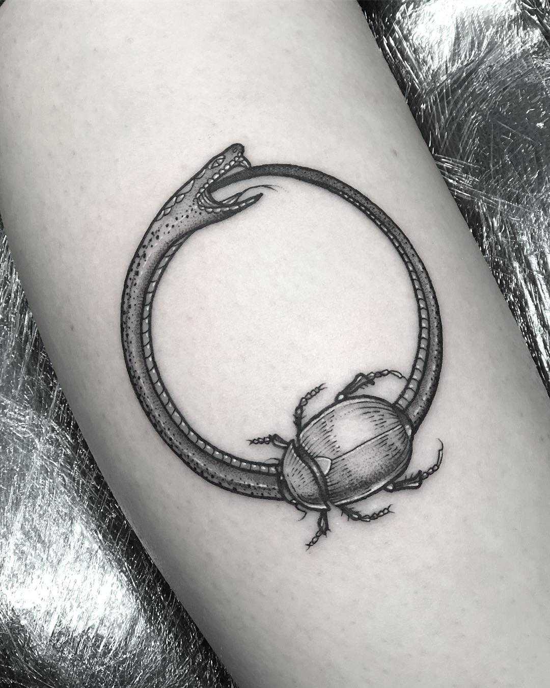 Ouroboros and scarab tattoo by Lozzy Bones