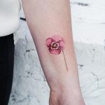 Pink pansy tattoo by tattooist picsola