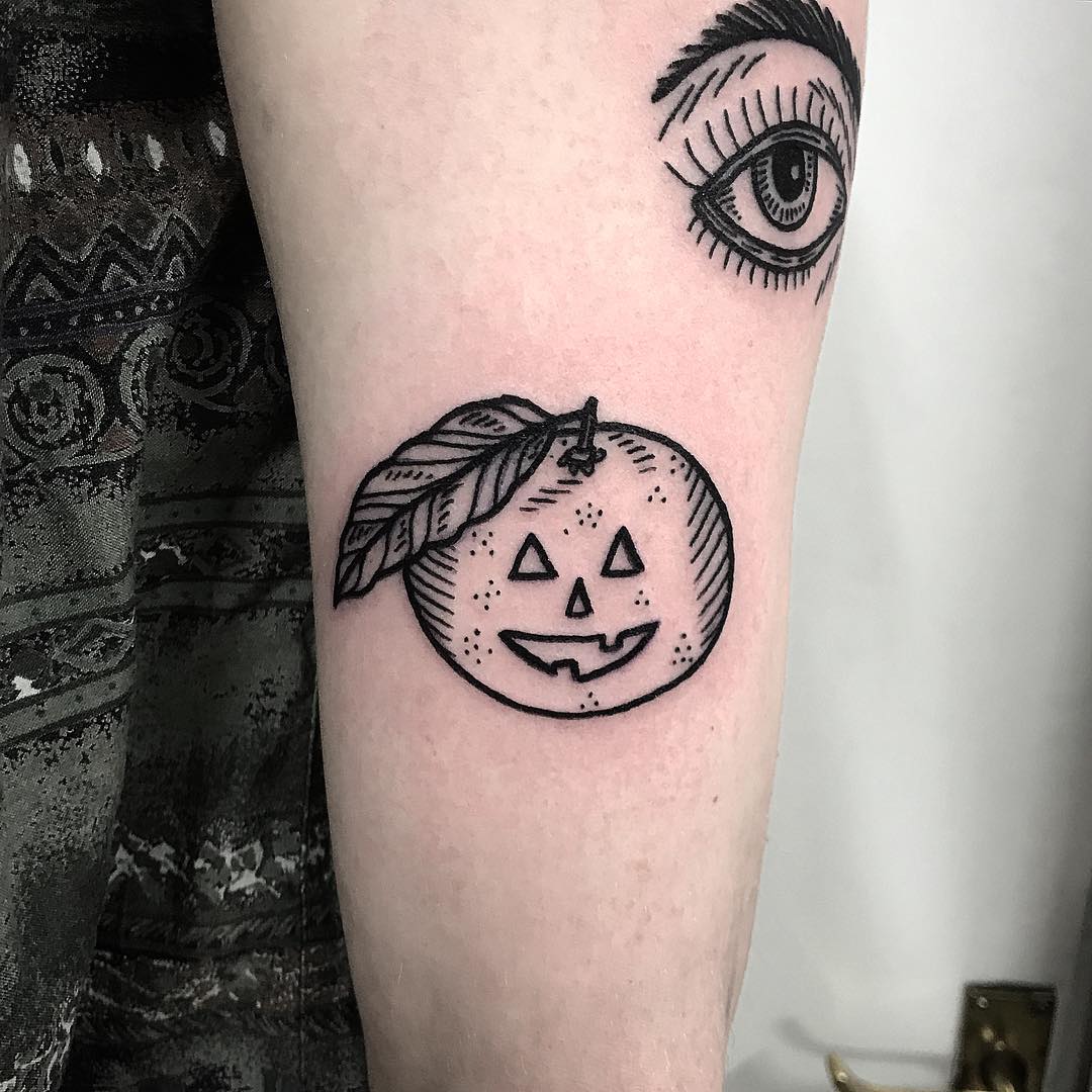 Pumpkin satsuma eye tattoo by Deborah Pow