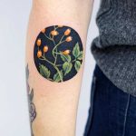 Rose hip tattoo by tattooist picsola