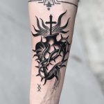 Sacred heart on a forearm by Javier Betancourt