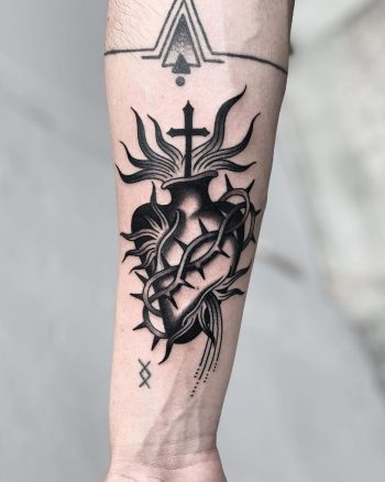 Sacred heart on a forearm by Javier Betancourt