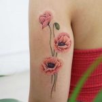 Salmon poppies tattoo by tattooist picsola