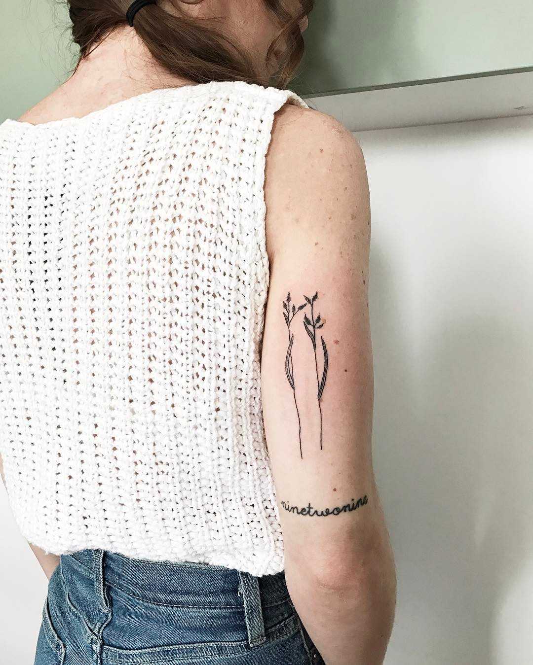 Simple spring stems tattoo by Kelli Kikcio