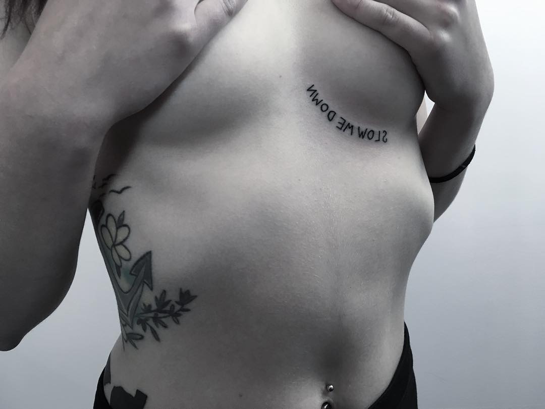 Slow me down backwards tattoo by Krzysztof Szeszko