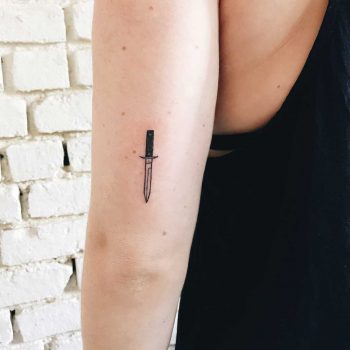 Small knife tattoo on an arm by Kelli Kikcio