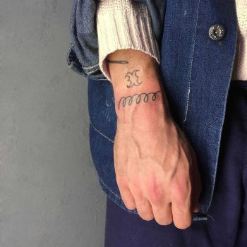 Spiral telephone wire tattoo by Jessica Rubbish