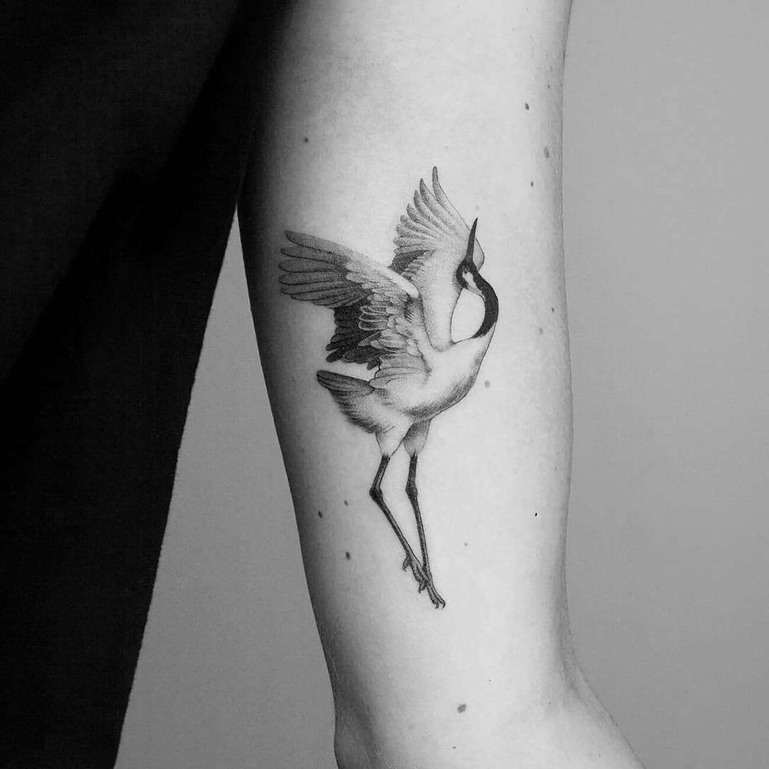 Subtle crane tattoo by Amanda Piejak