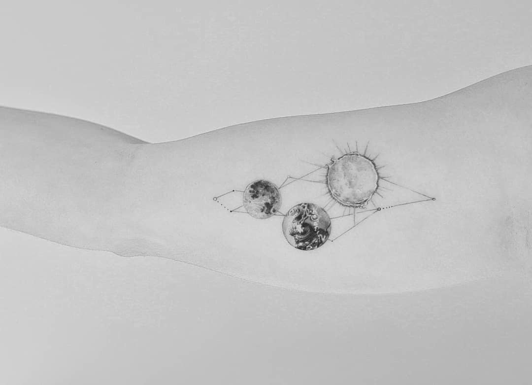 Sun, Earth, and Moon tattoo by Dragon Ink