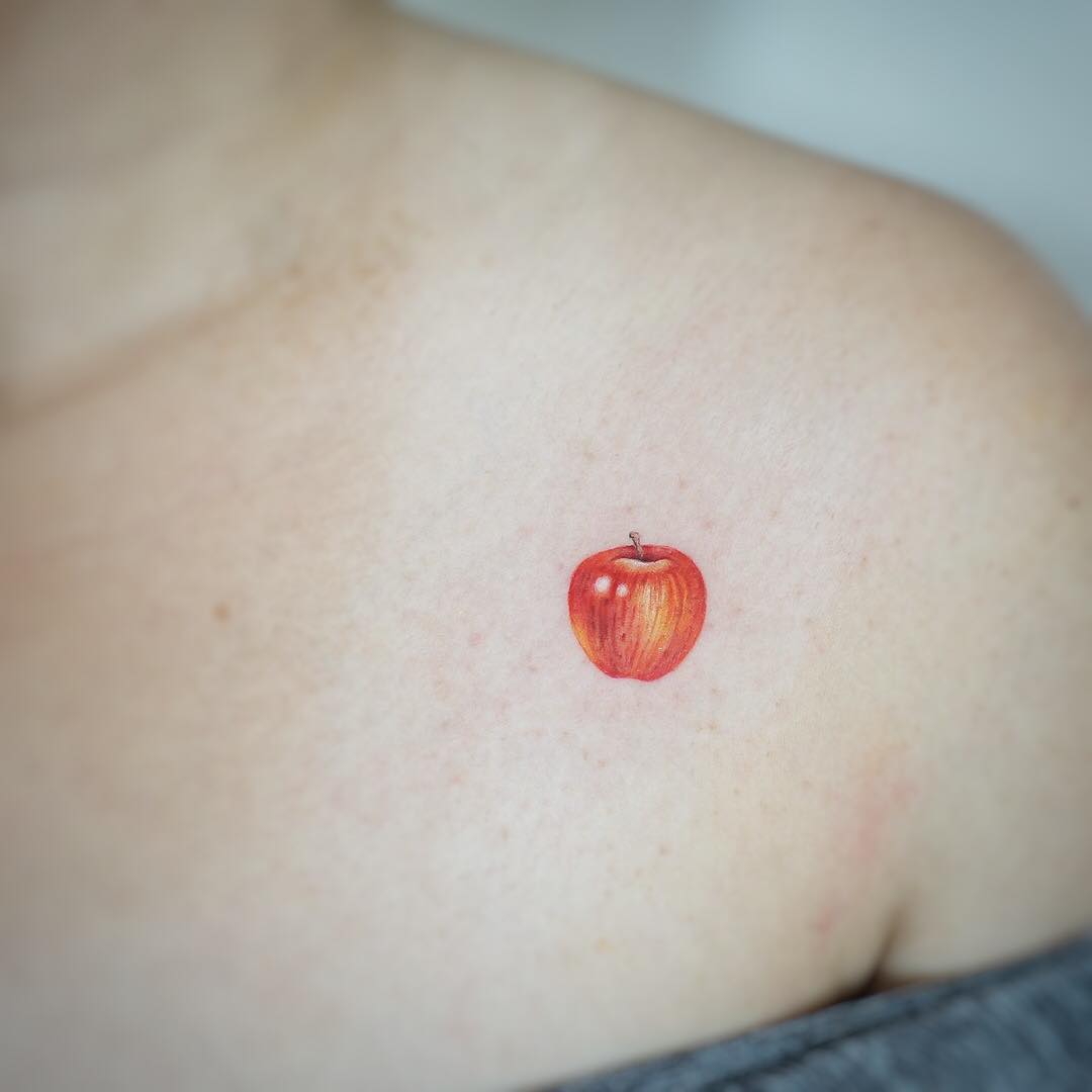 Tiny apple tattoo by tattooist G.NO