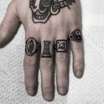 Tiny finger tattoos by Carina Soares