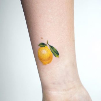 Tiny lemon tattoo by tattooist picsola