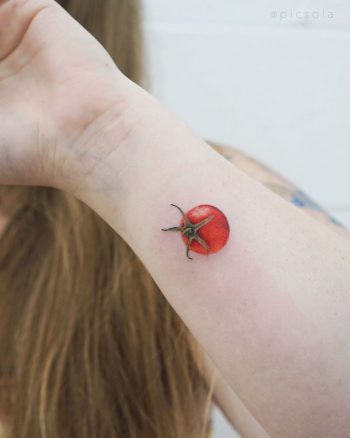 Tiny tomato tattoo by tattooist picsola